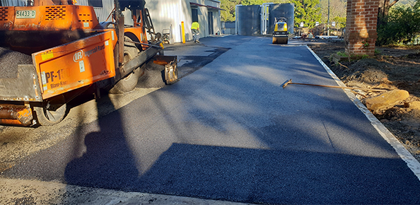 A driveway with a fresh coating of asphalt.